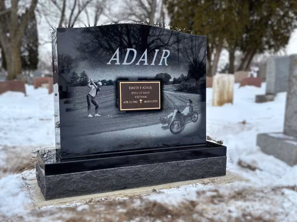 memorial with a golfer etching